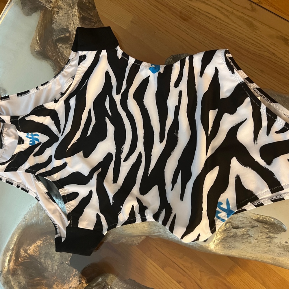 Worn once off white one piece swim boobs were adjusted a little to the side